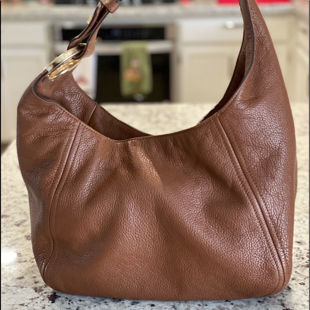 Michael Kors soft leather, brown, large hobo style purse gold detail.